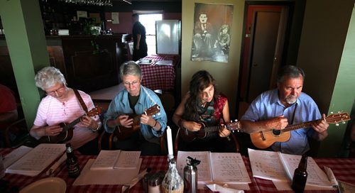 Members of the Ukulele CLub strum Tuesday evening. See Dave Sanderson's tale....July 30, 2013 - (Phil Hossack / Winnipeg Free Press) Sanderson says he will arrange to get names for me, this was impossible to do during the event........