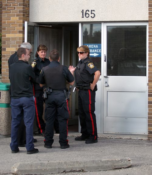 Police crowd around the entrance to Kirkfield Westwood Community Centre, 165 Sansome Ave., police and social services officials available to public to answer questions and provide info on services available. (Adam Wazny story) Officers outnumbered the number of civlians visiting. July 31, 2013 - (Phil Hossack / Winnipeg Free Press0