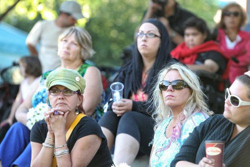 Mourners attend a candlelight vigil in memory of Gibson and her two children, two-year-old Anna and three-month-old Nicholas at The Forks Thursday evening. 130801 - August 01, 2013 Mike Deal / Winnipeg Free Press