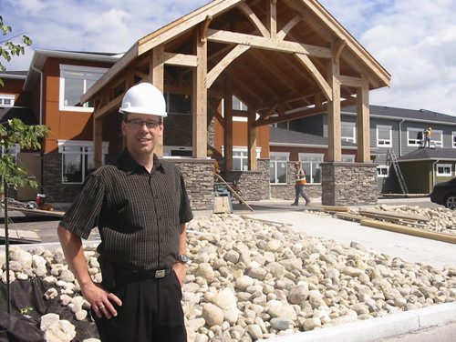 Gordon Daman, voluntary president of the new Heritage Life Personal Care Home in Niverville, oversees last-minute construction before its opening later this month. Bill Redekop/Winnipeg Free Press August 1, 2013