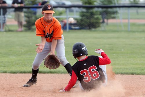 Brandon Sun 02082013 Brody Robinson #36 of the Midwest Allstars slides into second base before the ball makes it to Owen Harms #6 of the Winnipeg South Chiefs during Peewee AAA Provincial Championship action at Simplot Millennium Park on Friday afternoon. (Tim Smith/Brandon Sun)