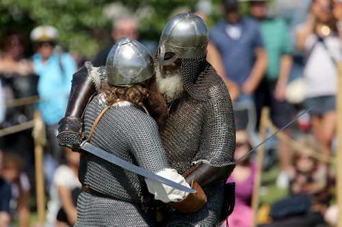 Members of Vikings Vinland, a group made up of members from across Canada, the US and Europe, battle one another during a demontration at the Icelandic Festival of Manitoba in Gimli, Saturday, August 3, 2013. (TREVOR HAGAN/WINNIPEG FREE PRESS)