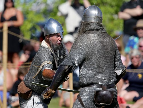 Members of Vikings Vinland, a group made up of members from across Canada, the US and Europe, battle one another during a demontration at the Icelandic Festival of Manitoba in Gimli, Saturday, August 3, 2013. (TREVOR HAGAN/WINNIPEG FREE PRESS)