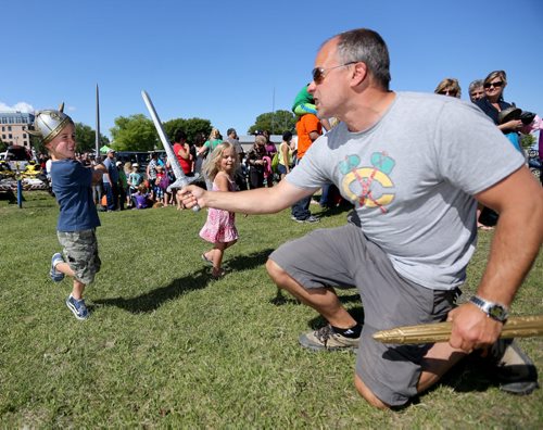Colton Boulanger, 4, battles his father, Trevor, at the Icelandic Festival of Manitoba in Gimli, Saturday, August 3, 2013. (TREVOR HAGAN/WINNIPEG FREE PRESS)