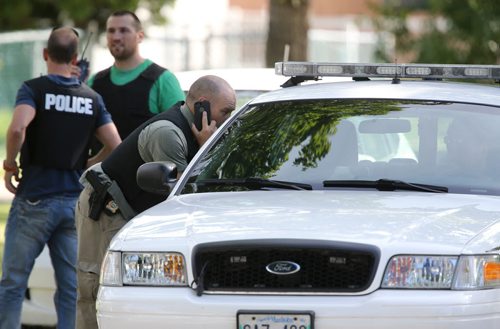 At least 6 Winnipeg Police units were searching the Ebby-Wentworth area for a suspect that an area resident says was breaking into homes, Sunday, August 4, 2013. (TREVOR HAGAN/WINNIPEG FREE PRESS)