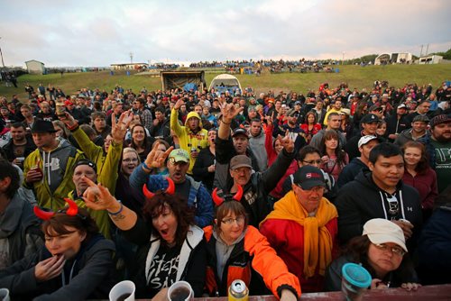 Brandon Sun 08042013 A large crowd gives it up for Monster Truck during their main stage set on the closing night of Rockin' the Fields of Minnedosa. (Tim Smith/Brandon Sun)