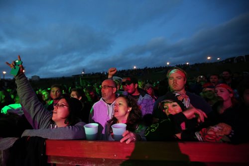 Brandon Sun 08042013 A large crowd gives it up for Monster Truck during their main stage set on the closing night of Rockin' the Fields of Minnedosa. (Tim Smith/Brandon Sun)