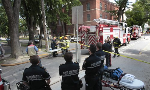 Paramedics, Police and Fire Fighters at 357 Assiniboine Ave. at Hargrave St. Tuesday after a report of a gas leak that forced an evacuation of the building .  Wayne Glowacki / Winnipeg Free Press Aug. 6  2013