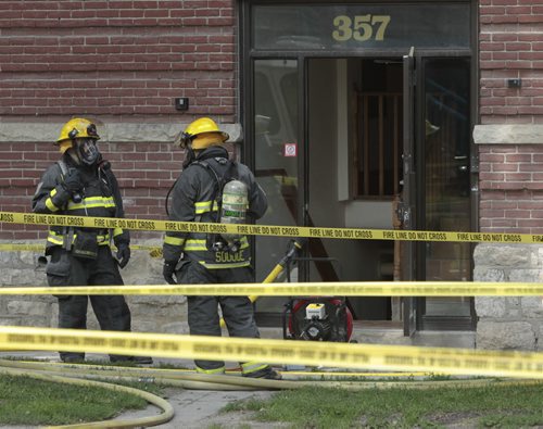 Fire Fighters at 357 Assiniboine Ave. at Hargrave St. Tuesday after a report of a gas leak that forced an evacuation of the building .  Wayne Glowacki / Winnipeg Free Press Aug. 6  2013