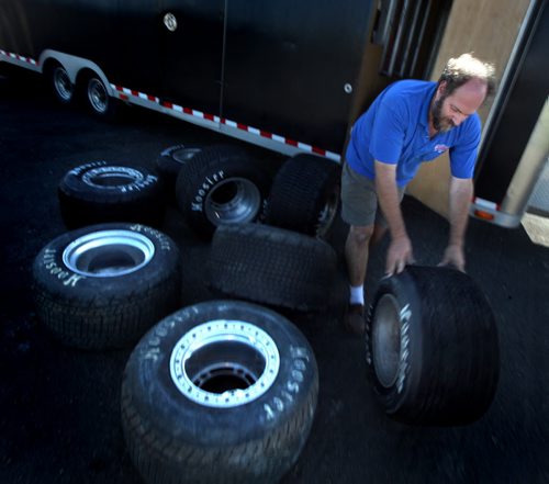 Dirt Track Racing....Day in the Life SHot Aug 1, 2013 Barry Dawson unloads wheels and tires to be used racenight at Red River Co-op Speedway's 40th anniversary....Aug 1, 2013 - (Phil Hossack / Winnipeg Free Press)
