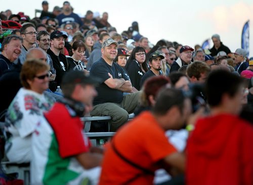 Dirt Track Racing....Day in the Life SHot Aug 1, 2013 Fans enjoy the sights sounds and smells from the grandstand race night at Red River Co-op Speedway.....Aug 1, 2013 - (Phil Hossack / Winnipeg Free Press)