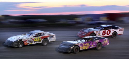 Dirt Track Racing....Day in the Life SHot Aug 1, 2013 Racers round the corner in a blurr race night at Red River Co-op Speedway.....Aug 1, 2013 - (Phil Hossack / Winnipeg Free Press)