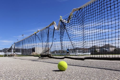 Tennis courts are in need of repair at Linden Woods Community Centre. BORIS MINKEVICH / WINNIPEG FREE PRESS. August 6, 2013