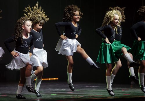 Irish dancers light up the stage at the Celtic Ireland pavilion at Folklorama. The pavilion is located at the Fort Garry Curling Club on Archibald.  BORIS MINKEVICH / WINNIPEG FREE PRESS.