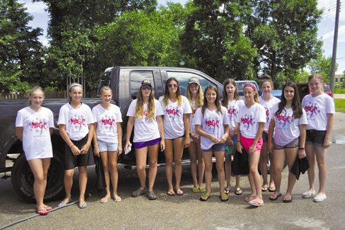 Canstar Community News Members of the U14 Magic AA Ringette team earned more than $800 with a team car wash on July 20.