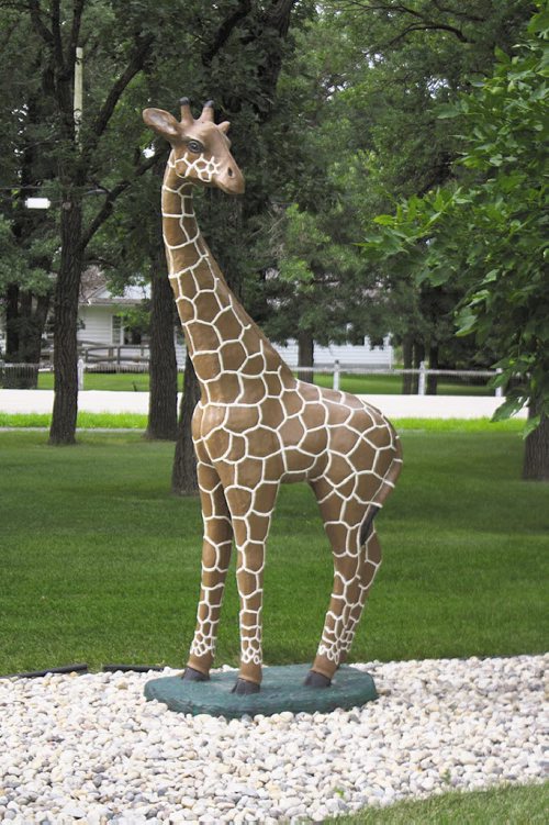 Canstar Community News Aug. 2 -- Langley the giraffe, who watches over Darelen and Ernie Borowski's yard, is certainly a noticeable piece of garden art.