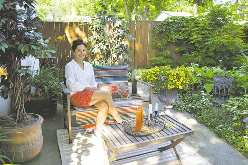 Canstar Community News Aug. 7 -- Joanie Bailey cherishes the peace and quiet of her back garden in Fort Garry. Helen Lepp-Friesen/SPECIAL TO CANSTAR