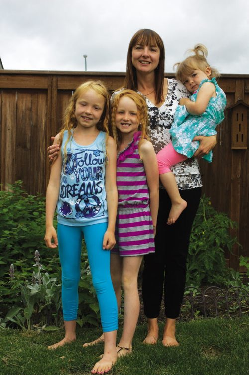 Canstar Community News July 31, 2013 - Former Transcona resident Kristen McDowell is shown with daughters Calla, Maya, and Aria. The family is organizing a run in memory of their daughter and sister Georgia, who died in 2009 of spinal muscular atrophy. (DAN FALLOON/CANSTAR COMMUNITY NEWS/HERALD)
