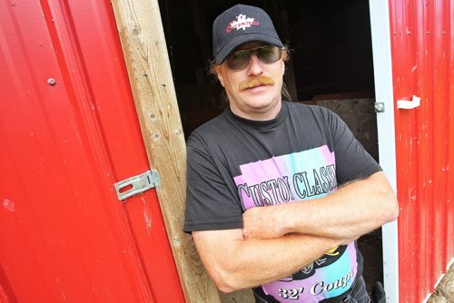 James Kebernik on his farm where some of the cattle that he raises will eventually end up as burgers in the restaurant he runs with his wife at Robyn's Drive In on Hwy 12 and 317. 130807 - August 07, 2013 Mike Deal / Winnipeg Free Press
