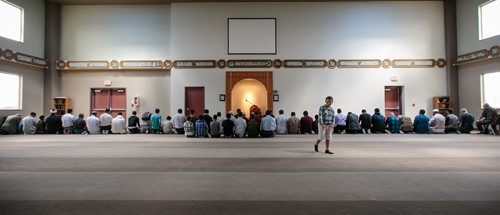 Eid celebrants pray at the Grand Mosque on Waverley on Thursday afternoon. A potluck at the mosque was one of many Eid celebrations in Winnipeg, which marks the end of the Islamic holy month of Ramadan. 130808 - Thursday, August 08, 2013 - (Melissa Tait / Winnipeg Free Press)