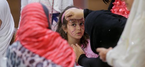 Samia Misbah has her face painted during a potluck celebrating Eid at the Grand Mosque on Waverley Thursday afternoon. The celebration was one of many in Winnipeg to mark the start of Eid and the end of Ramadan, the Islamic holy month of fasting. 130808 - Thursday, August 08, 2013 - (Melissa Tait / Winnipeg Free Press)