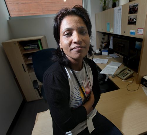 Dhirta Subedi poses in her office at the Welcome Center.  Newcomers to Canada don't just face the challenges of adjusting to a new language, community and culture. They're often faced with adapting to a new financial system too. An immigrant discusses her experience. Joel Schlessinger story. August 8, 2013 - Phil Hossack / Winnipeg Free Press)