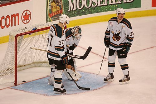 BORIS MINKEVICH / WINNIPEG FREE PRESS 070514 Moose goalie Wayne Flaherty is consoled by team members Lee Goren and Dustin Wood.