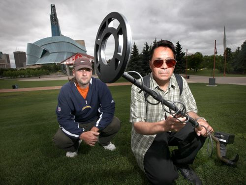 Donald SInclair (right) was arrested and held for "illegal digging" on the Forks festival site in front of the Human Rights Museum. Police are now refusing to return his tools even though they haven't charged the treasure hunter wh had permission to search the grounds with his metal detector. Fellow metal detector friend David Neyedli poses with him. See Gord Sinclair's story. August 9, 2013 - (Phil Hossack / Winipeg Free Press)