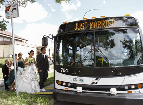 Just Married. Lou and Christine Orjalo climb aboard a city transit bus after tying the knot at Christ Lutheran Church on Inkster Blvd. at Sinclair St. on Saturday afternoon. Saturday, August 10, 2013. (JESSICA BURTNICK/WINNIPEG FREE PRESS)