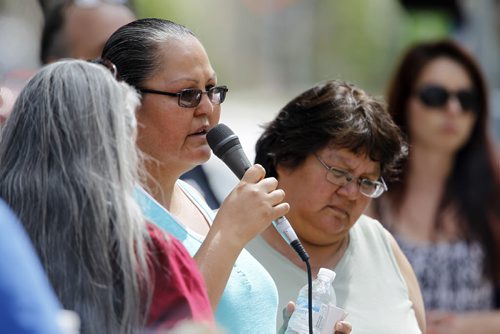 Across from the Remand Centre, Cheryl James speaks about her sister Kinew James who died while in custody, during National Prisoner Justice Day, Saturday, August 10, 2013. (TREVOR HAGAN/WINNIPEG FREE PRESS)