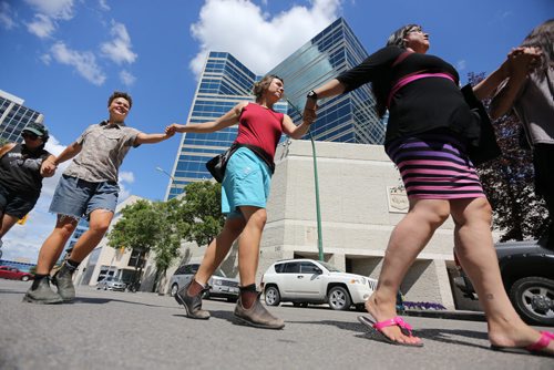 A circle dance on the street outside the Remand Centre during National Prisoner Justice Day, Saturday, August 10, 2013. (TREVOR HAGAN/WINNIPEG FREE PRESS)