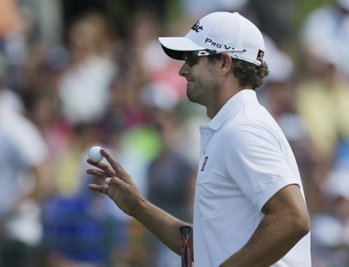 Adam Scott, of Australia, waves after a par on the second hole during the third round of the PGA Championship golf tournament at Oak Hill Country Club, Saturday, Aug. 10, 2013, in Pittsford, N.Y. (AP Photo/Patrick Semansky)