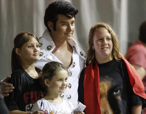 Dave Stiglmayr who performs under the stage name John Davis (formerly Little Dave) poses for a photo with member of the audience at The Gimli Elvis Festival on Saturday, August 10, 2013. (JESSICA BURTNICK/WINNIPEG FREE PRESS)