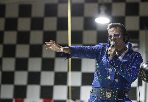 Gerry "Big Bear" Barrett of Winnipeg says he has enough trouble remembering his own name without trying to memorize all 430 available Elvis songs. But his hobby and passion turned into his business, as he's been putting on his blue jumpsuit for the past three years. Gimli Elvis Festival on Saturday, August 10, 2013. He is one of (JESSICA BURTNICK/WINNIPEG FREE PRESS)