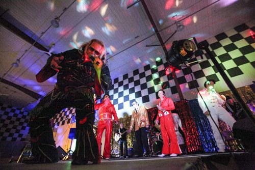 In a final tribute to The King, Dave Greene leads the Elvi as they sing together on stage and the audience waves glowsticks in the dark. The Gimli Elvis Festival on Saturday, August 10, 2013. (JESSICA BURTNICK/WINNIPEG FREE PRESS)