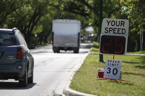 A mobile radar station on the University of Manitoba campus displays a driver's speed as he or she approaches, which is then recorded on a chart by a U of M special constable. Since the program's inception in July, the university has recorded 51% of drivers going 11 kilometres per hour or higher than the 30 km/h posted limit on internal roads. Tuesday, August 13, 2013. (NICK MARTIN) (JESSICA BURTNICK/WINNIPEG FREE PRESS)