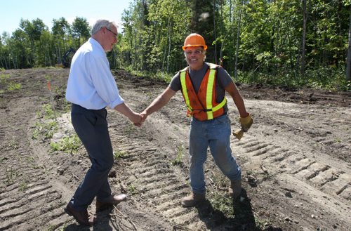 Manitoba Premier Greg Selinger meets construction worker Mike Byzuk of Don Sikora Contarcting Ltd at the unnamed Tim Horton Youth Leadership Camp to be built on Sylvia Lake on the Winnipeg River system-See Bruce Owen story- August 13, 2013   (JOE BRYKSA / WINNIPEG FREE PRESS)