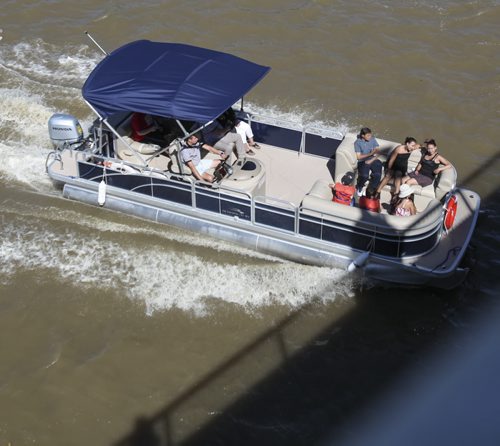 Many people chose to use water buses to commute down the Red River today, as seen from the Provencher St. Bridge. Temperature highs are expected to stay in the mid- to high-20s all for the rest of the week. Tuesday, August 13, 2013. (JESSICA BURTNICK/WINNIPEG FREE PRESS)