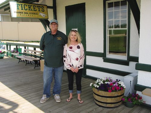 Canstar Community News July 31, 2013 - Bob Goch, president of the Vintage Locomotove Society Inc, and Catherine Giffin, Prairie Dog Central Railway's marketing manager stand outside tha train depot in the RM of Rosser. (ANDREA GEARY/CANSTAR COMMUNITY NEWS)