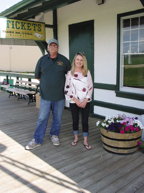Canstar Community News July 31, 2013 - Bob Goch, president of the Vintage Locomotive Society Inc., and Catherine Giffin, Prairie Dog Central Railway's marketing manager stand outside the train depot in the RM of Rosser. (ANDREA GEARY/CANSTAR COMMUNITY NEWS)