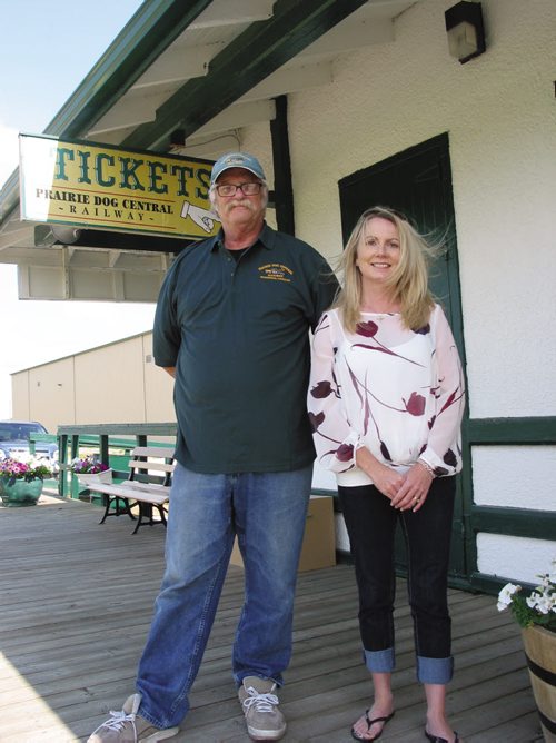 Canstar Community News July 31, 2013 - Bob Goch, president of the Vintage Locomotive Society Inc., and Catherine Duffin, marketing manager for the Prairie Dog Central Railway, stand outside the train depot in the RM of Rosser. (ANDREA GEARY/CANSTAR COMMUNITY NEWS)