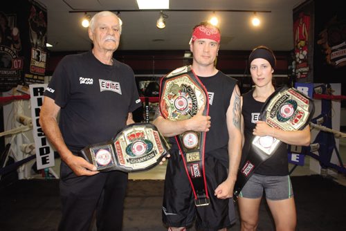 Canstar Community News Aug. 8, 2013 - Coach Dejan "Pappa" Paunovic, Kent Brown, and Patricia Girardin of Winnipeg Elite Boxing and MMA Academy show off the three belts the gym's fighters won at the 13th annual Ringside World Championships in Independence, Missouri earlier this month. (DAN FALLOON/CANSTAR COMMUNITY NEWS/HERALD)