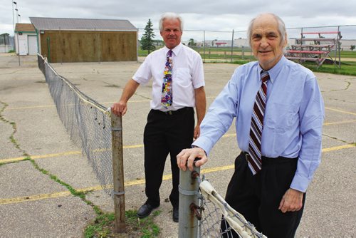 Canstar Community News Northwood Community Centre premises manager Curtis Kazuk and past president George Vanderlip say the club needs to fundraise $125,000 to fix its tennis courts, a relic from when the club was first established in 1953. (MATT PREPROST/CANSTAR)