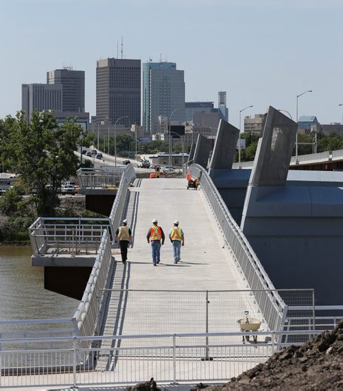 Pedestrian / Cycling bridge spanning the Red River next to the Disraeli Bridge , built on the old Disraeli Bridge piers is about to open Äì metal screen art depicts city skyline decorate the bridge Äì aldo  santin story    KEN GIGLIOTTI / Aug 14 2013 / WINNIPEG FREE PRESS