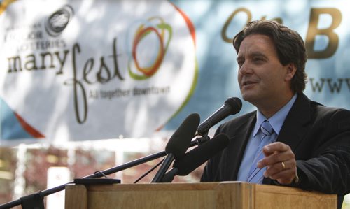 Executive Director of the Downtown BIZ, Stefano Grande, announces the launch of the third annual ManyFest on Broadway today, which began with a food truck war between businesses Pimp My Rice, Habanero Sombrero and On A Roll. Wednesday, August 14, 2013. (ELIZABETH FRASER) (JESSICA BURTNICK/WINNIPEG FREE PRESS)