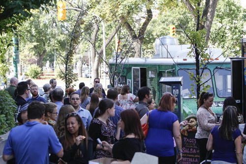 The Downtown BIZ launched the third annual ManyFest on Broadway today with a food truck war between businesses Pimp My Rice, Habanero Sombrero and On A Roll (pictured). Wednesday, August 14, 2013. (ELIZABETH FRASER) (JESSICA BURTNICK/WINNIPEG FREE PRESS)