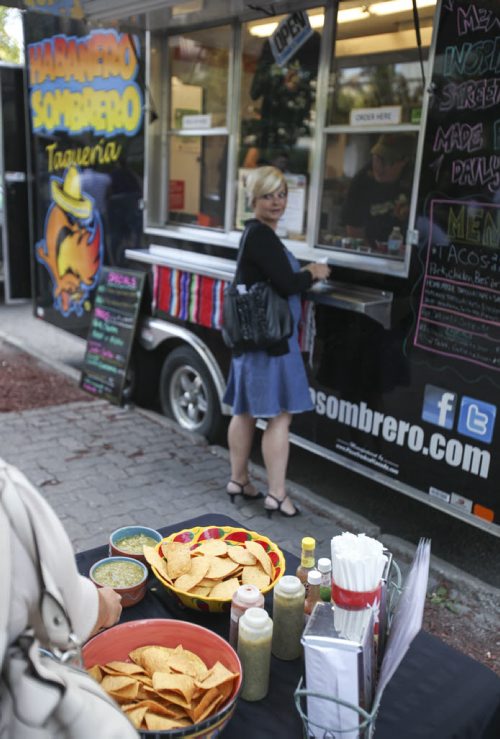 The Downtown BIZ launched the third annual ManyFest on Broadway today with a food truck war between businesses Pimp My Rice, Habanero Sombrero (pictured) and On A Roll. Wednesday, August 14, 2013. (ELIZABETH FRASER) (JESSICA BURTNICK/WINNIPEG FREE PRESS)