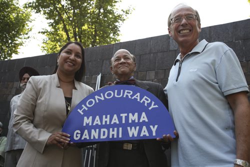 (Left to right) Councillor Devi Sharma, Dr. K. Dakshinamurti (president of the Mahatma Gandhi Centre of Canada) and Mayor Sam Katz announced an honourary street naming at The Forks today. The Broadway Promenade, located between the skatepark and Canadian Museum of Human Rights, has been renamed Mahatma Gandhi Way. Thursday, August 15, 2013. (JESSICA BURTNICK/WINNIPEG FREE PRESS)