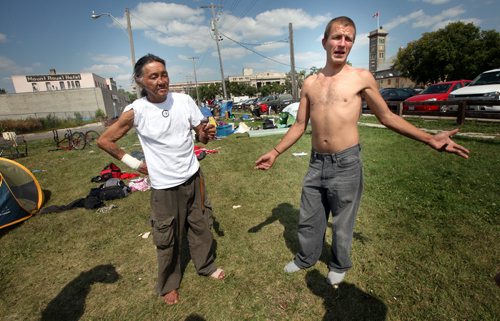 Chin-Pa-In (left) and Daniel, street people camped out on Martha Street across the street from the Salvation Army describe their life Thursday afternoon in the small tent village. See Oliver's story. August 15, 2013 - (Phil Hossack / Winnipeg Free Press)