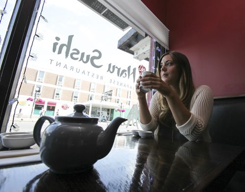 Rebecca Henderson reminisces about her past experiences at Naru Sushi, located at 159 Osborne St., over a cup of tea. Thursday, August 15, 2013. (REBECCA HENDERSON) (JESSICA BURTNICK/WINNIPEG FREE PRESS)